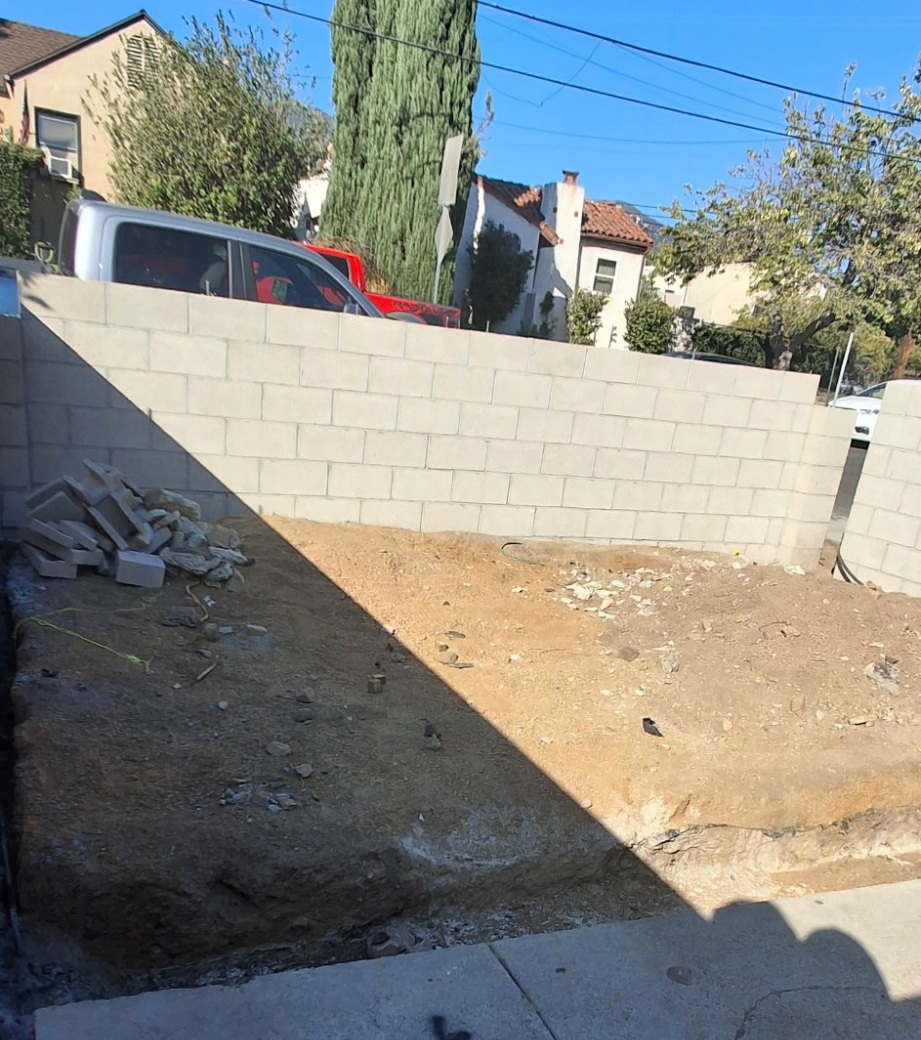 Concrete block wall under construction at a residential property